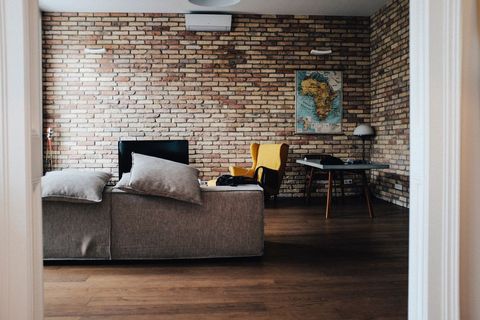 Modern Loft Style Living Room with Brick Walls and Vintage Decor