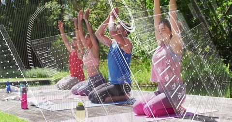 Outdoor Yoga Group Embracing Technology in Park Setting