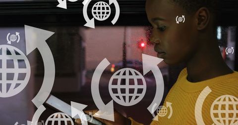 African American Female Using Tablet on Bus with Digital Globe Overlay