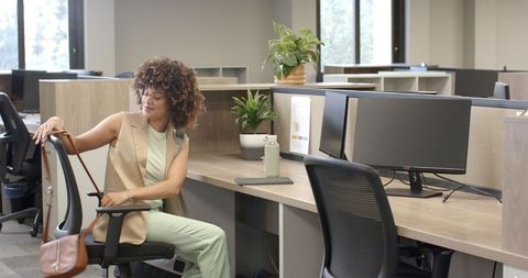 Businesswoman Organizing Personal Space in Minimalist Open Office