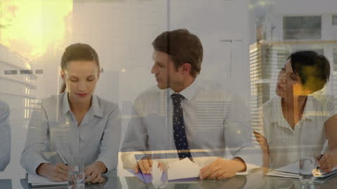 Cityscape Overlay on Business Team in Modern Office