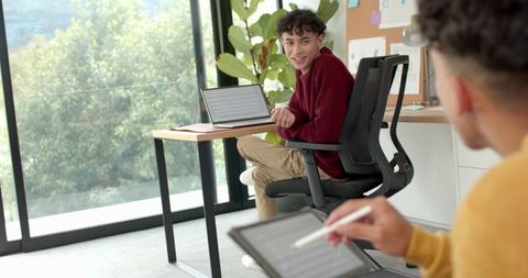 Male Colleagues Collaborating in Modern Office