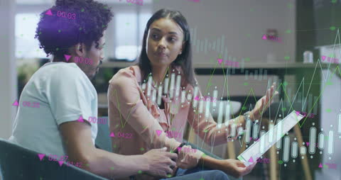 Two Professionals Analyzing Financial Data on Tablet