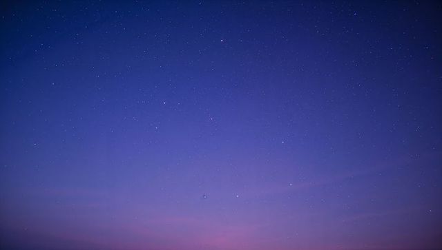 Starry Twilight Sky with Gradient from Blue to Pink