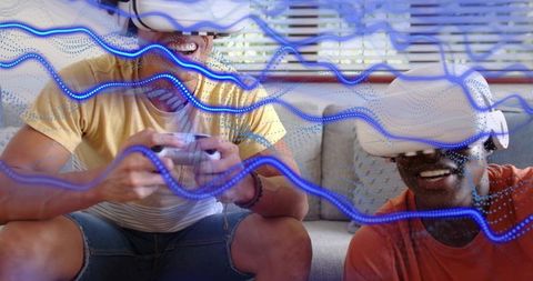 Friends playing virtual reality on couch with neon trails, multiplayer vr gaming at home