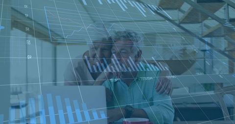 Senior couple analyzing retirement finances on laptop with stock charts overlay at home