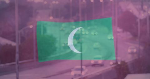 Floating Crescent Flag Over Urban Highway at Dusk