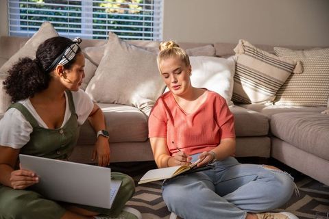 Diverse Friends Studying Together in Cozy Living Room Setting