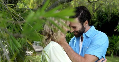 Loving Couple Sharing Tender Moment in Lush Garden - Download Free Stock Images Pikwizard.com