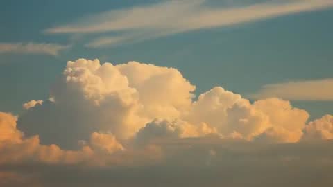 Dramatic Cumulonimbus Clouds in Golden Hour Majesty