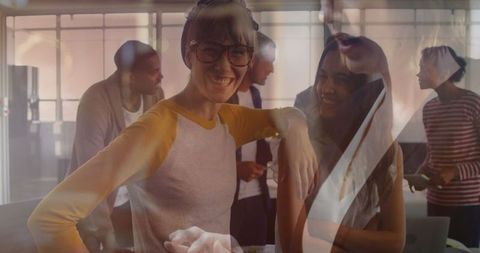 Smiling Woman Engaging in Dynamic Teamwork Environment