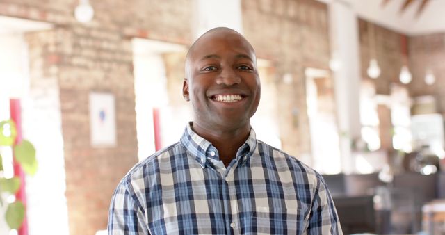 Smiling African-American Man in Modern Office - Download Free Stock Images Pikwizard.com