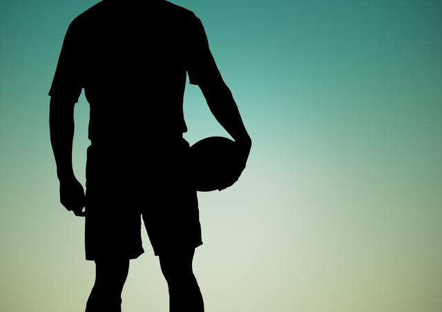 Digital composition of silhouette of player holding rugby ball against green background