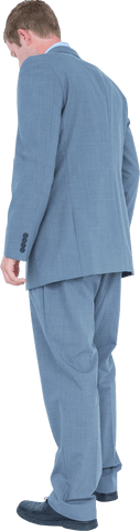 Businessman wearing blue suit looking down transparent background