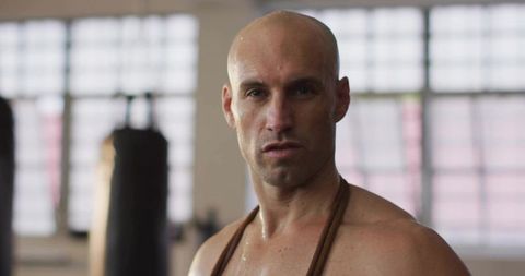 Determined Athlete With Jump Rope in Boxing Gym