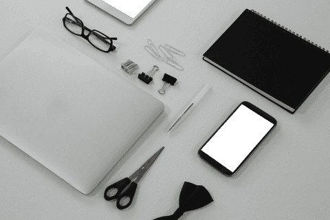 Transparent Office Essentials Display on White Surface