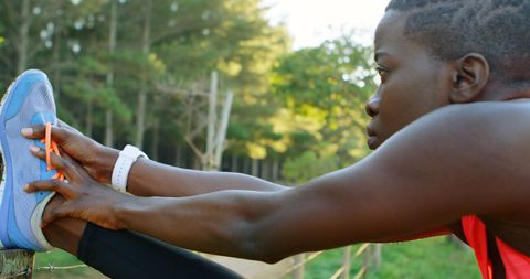 Focused African American Athlete Stretching Outdoors in Nature - Download Free Stock Images Pikwizard.com