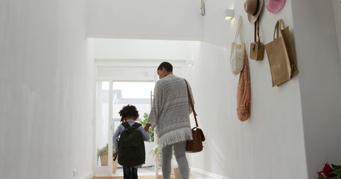 Mother and Daughter Leaving Home for School