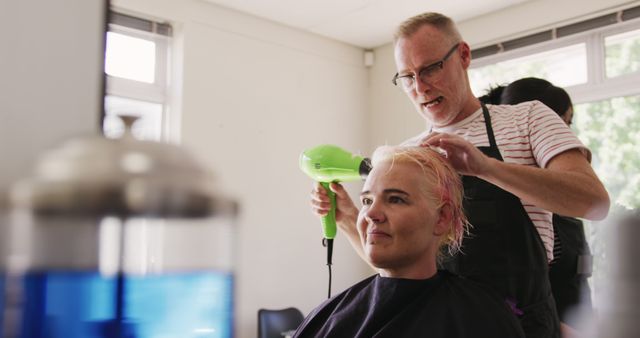 Hairdresser Drying Hair of Relaxed Customer in Salon - Download Free Stock Images Pikwizard.com