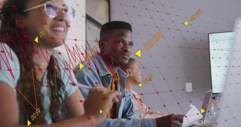 Smiling Diverse Team Engaging in Digital Data Analysis