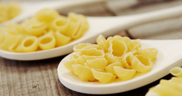 Pasta Varieties on Wooden Spoons with Rustic Background - Download Free Stock Images Pikwizard.com