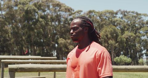 Man focused during outdoor bootcamp in forest area