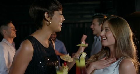 Women Enjoying Cocktail Happiness at Nightclub - Download Free Stock Images Pikwizard.com