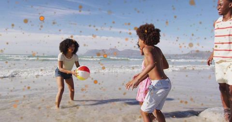 Family playing beach ball and splashing on sunny shore with colorful speckle overlay