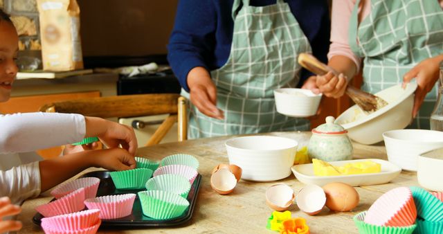 Family Baking Together in Kitchen with Colorful Cupcake Liners and Ingredients - Download Free Stock Images Pikwizard.com