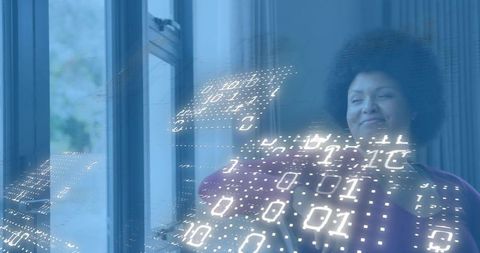 Professional woman standing by window with binary hologram overlay, contemplating future
