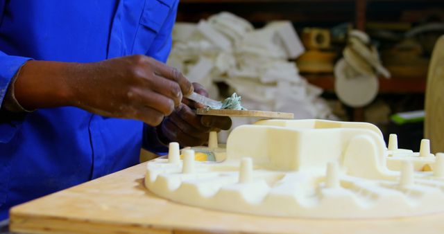 Close-up of Artisan Sculpting Mold in Workshop - Download Free Stock Images Pikwizard.com