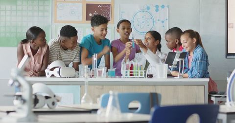 Indian Teacher Guiding Enthusiastic Students in Modern Science Lab