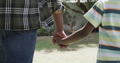 Father and Child Holding Hands Outdoors in Emotional Moment - Download Free Stock Images Pikwizard.com