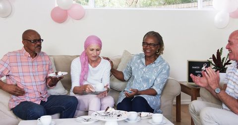 Senior Friends Enjoying Cake and Conversation in Living Room Gathering
