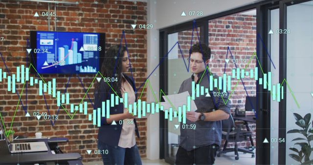 Business colleagues analyzing charts and graphs in modern office - Download Free Stock Images Pikwizard.com