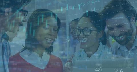 Diverse team analyzing stock market data on laptop graph overlay