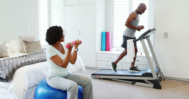 Senior Couple Exercising at Home on Treadmill and Exercise Ball - Download Free Stock Images Pikwizard.com