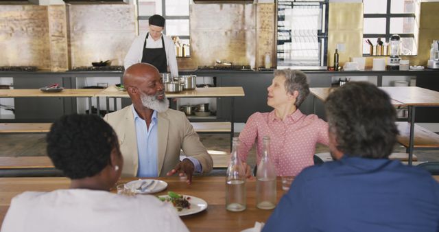 Group of Friends Enjoying Meal in Modern Kitchen - Download Free Stock Images Pikwizard.com