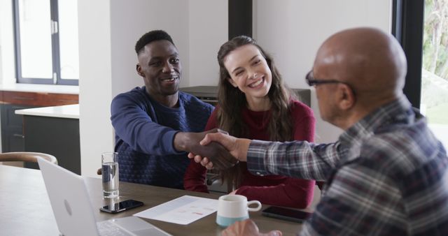 Multiracial couple meeting with financial advisor at home - Download Free Stock Images Pikwizard.com