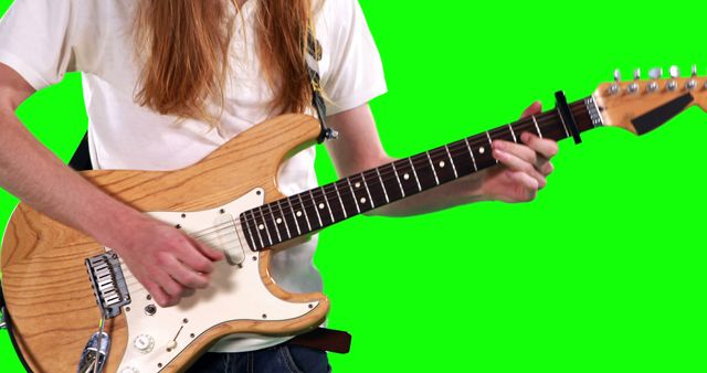 Young Musician Playing an Electric Guitar Against Green Screen - Download Free Stock Images Pikwizard.com