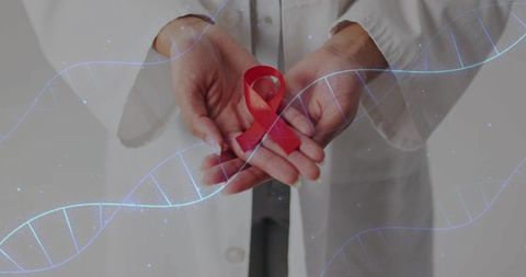 Medical professional holding red awareness ribbon cupped in hands with dna helix overlay