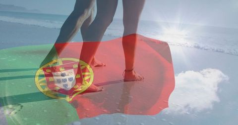 Couple walking on shoreline with portuguese flag overlay, barefoot summer travel concept