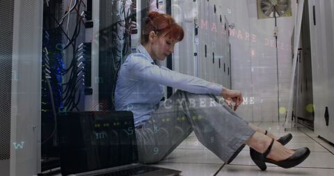Distressed Woman in Server Room Amid Cybercrime Concerns