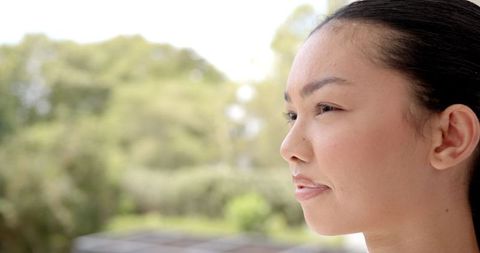 Serene woman smiling in outdoor nature setting