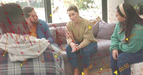 Support group discussing together on living room couch with data overlay visualization