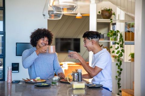 Diverse Friends Enjoying Breakfast Together in Modern Kitchen