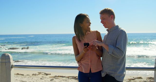 Smiling Couple Enjoying Scenic Beach View Together - Download Free Stock Images Pikwizard.com