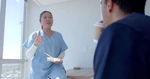 Healthcare Professionals Enjoying Casual Break in Hospital Environment