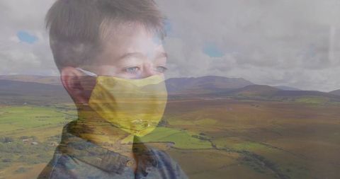 Double Exposure of Child with Face Mask Over Rolling Countryside