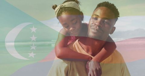 Father Carrying Daughter on Beach Vacation with Flag Overlay